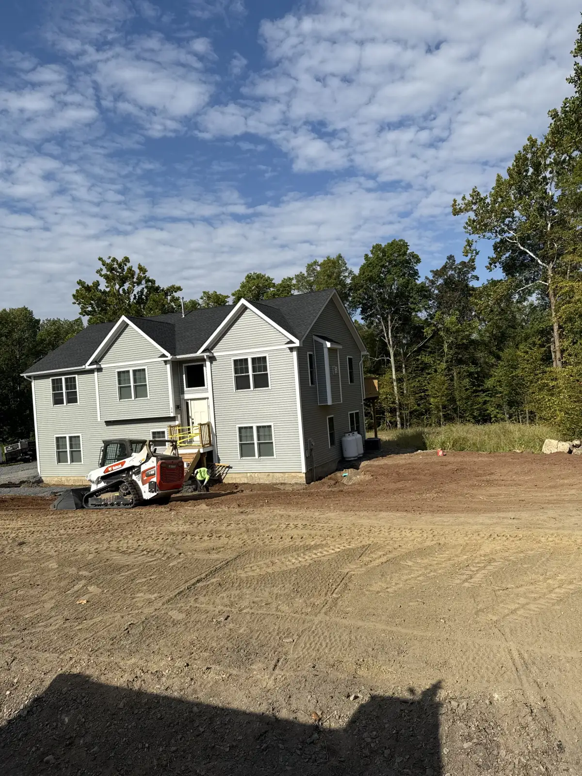 Drainage system integrated with paver patio hardscape