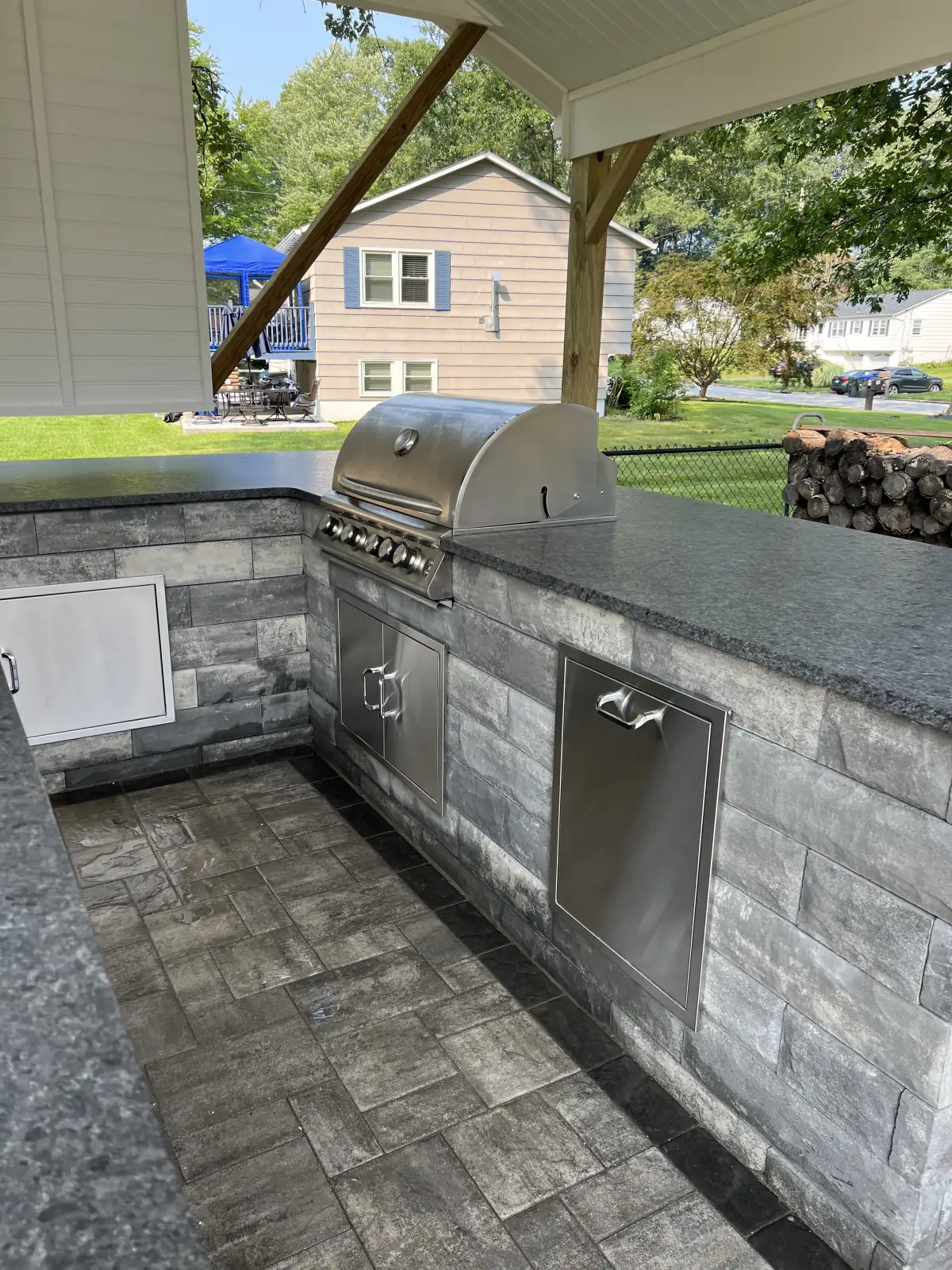 Built-in grill and storage set into a masonry outdoor kitchen