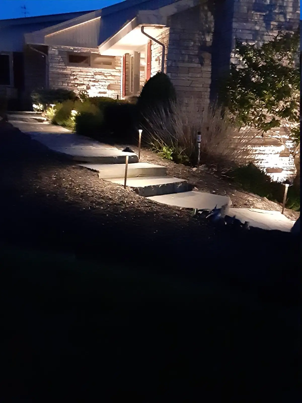 Finished hardscape with retaining wall and plantings